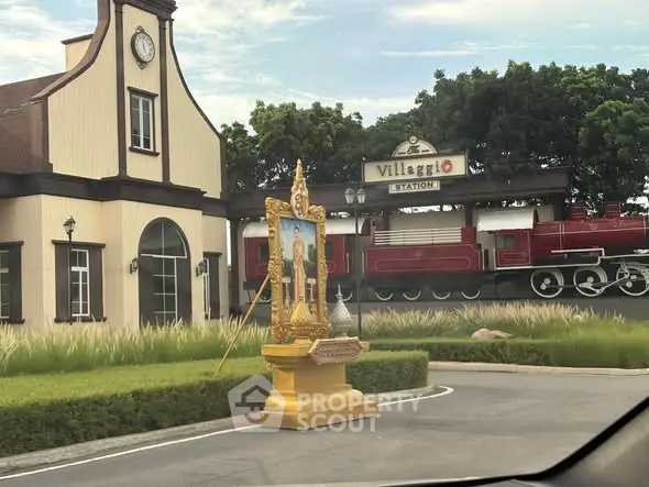 Charming Villaggio Station with vintage train and classic architecture