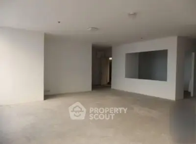 Spacious empty room with neutral walls and large window opening, ideal for customization.