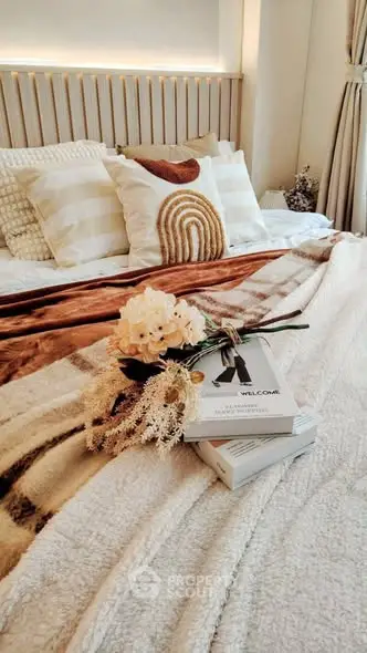 Cozy bedroom with stylish decor and plush bedding, perfect for relaxation and comfort.