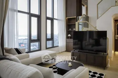 Luxurious living room with high ceilings and stunning city view