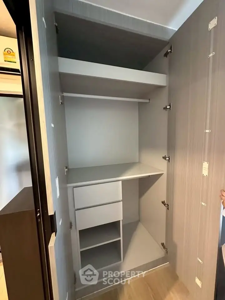 Spacious modern storage closet with shelves and drawers in sleek design