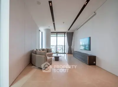 Spacious modern living room with panoramic city view and elegant furnishings.