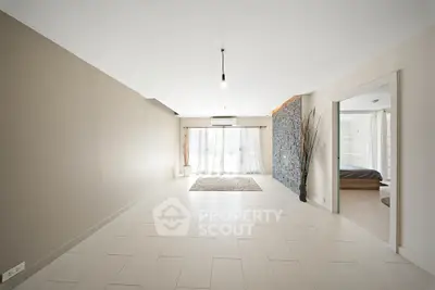 Spacious modern living room with natural light and minimalist design