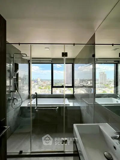 Luxurious bathroom with stunning city view and modern glass shower enclosure.