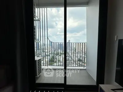 Stunning city view from modern apartment balcony with sleek railing design.