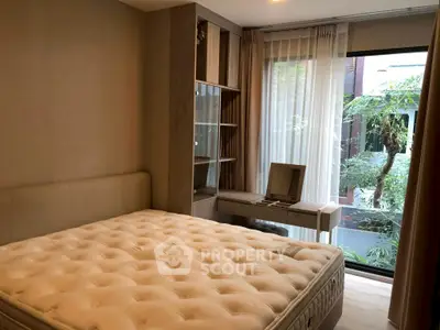 Cozy bedroom with plush mattress and large window view