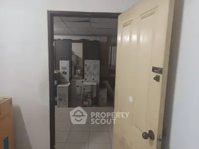 Storage room with boxes and appliances, ideal for organizing household items.