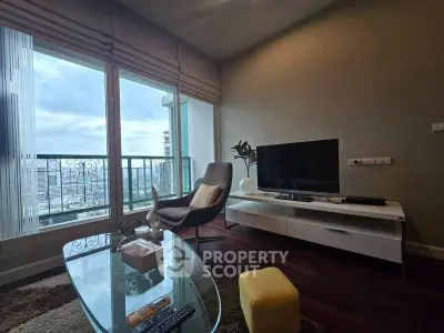 Modern living room with city view, stylish furniture, and large windows.
