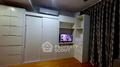 Modern living room with built-in storage and TV unit