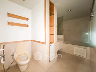 Spacious bathroom with modern fixtures and bathtub in a stylish home.