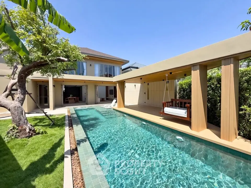 Luxurious modern home with private pool and lush garden, perfect for relaxation and entertainment.