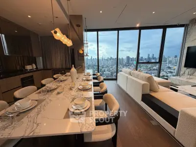 Luxurious open-plan kitchen and living room with stunning city skyline view