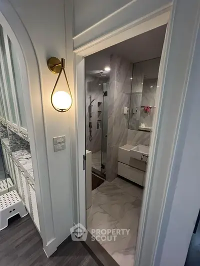 Modern bathroom with sleek design and elegant lighting in a contemporary home.