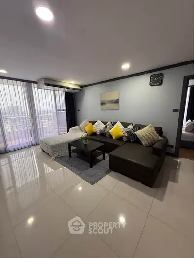 Spacious modern living room with cozy sectional sofa and elegant decor