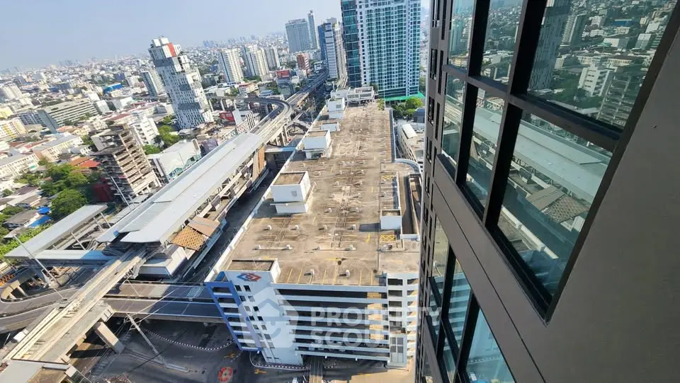 Stunning cityscape view from high-rise building with expansive urban skyline and modern architecture.