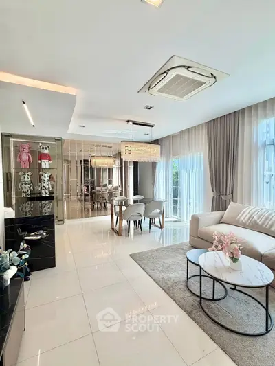 Luxurious modern living room with elegant decor and ample natural light