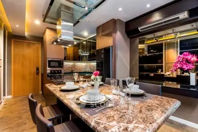 Luxurious modern kitchen with elegant dining setup and marble countertop