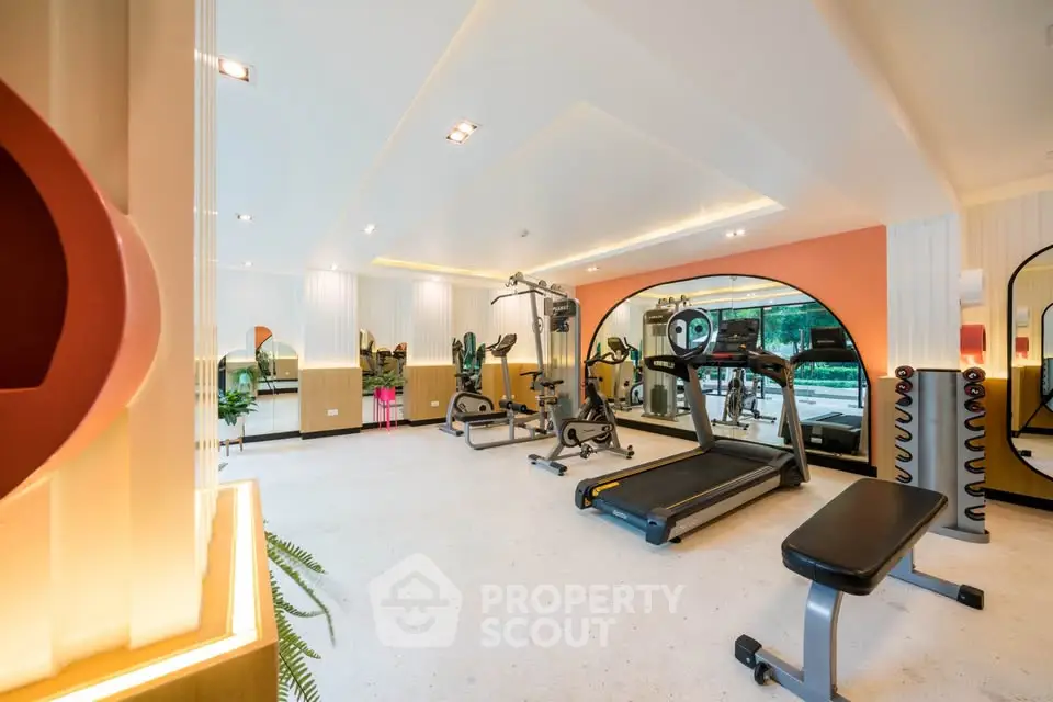 Modern gym with state-of-the-art equipment and stylish interior design.