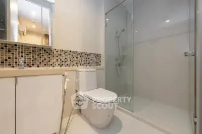 Modern bathroom with glass shower and sleek tile design
