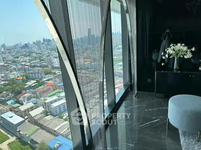 Luxurious high-rise apartment with stunning city view and modern interior design.