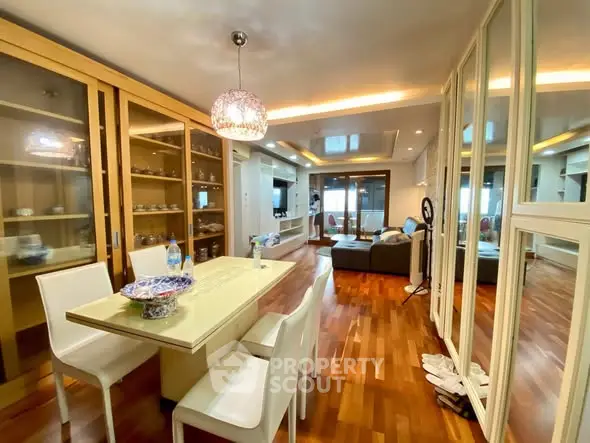 Spacious modern living room with elegant dining area and wooden flooring