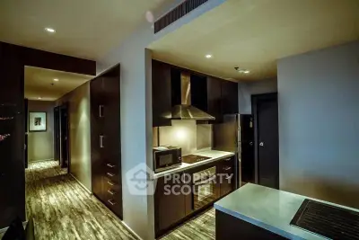 Modern kitchen with sleek cabinetry and built-in appliances in a stylish apartment.