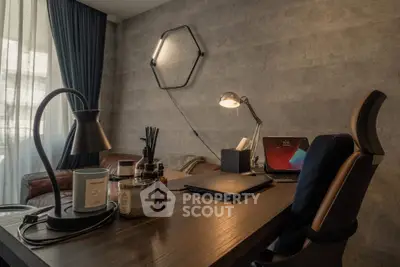 Modern study room with stylish desk, laptop, and ambient lighting