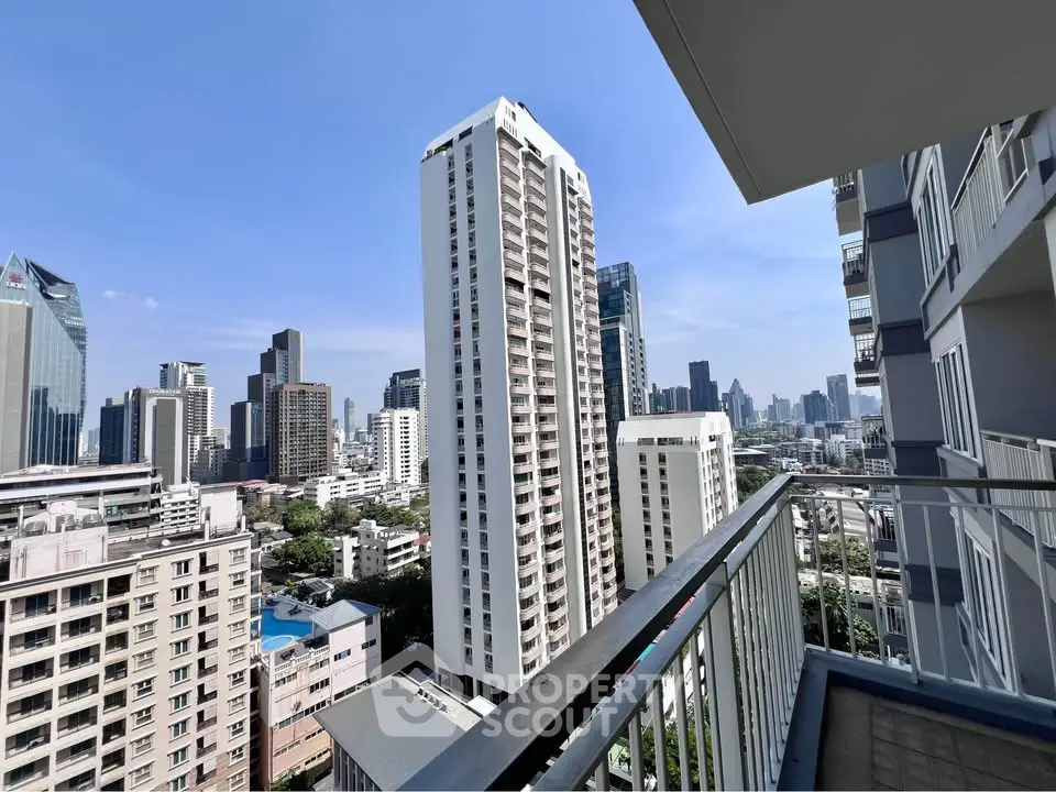 Stunning cityscape view from a high-rise balcony in a modern urban setting.