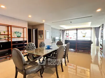 Luxurious open-plan living room with elegant dining area and stylish decor
