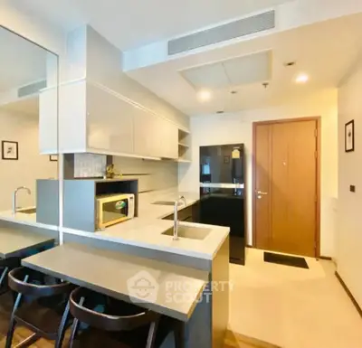 Modern kitchen with sleek design and breakfast bar seating