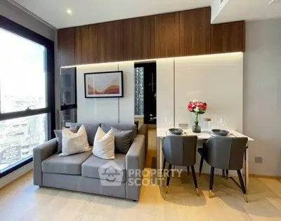 Modern living room with cozy sofa and elegant dining area in a stylish apartment.
