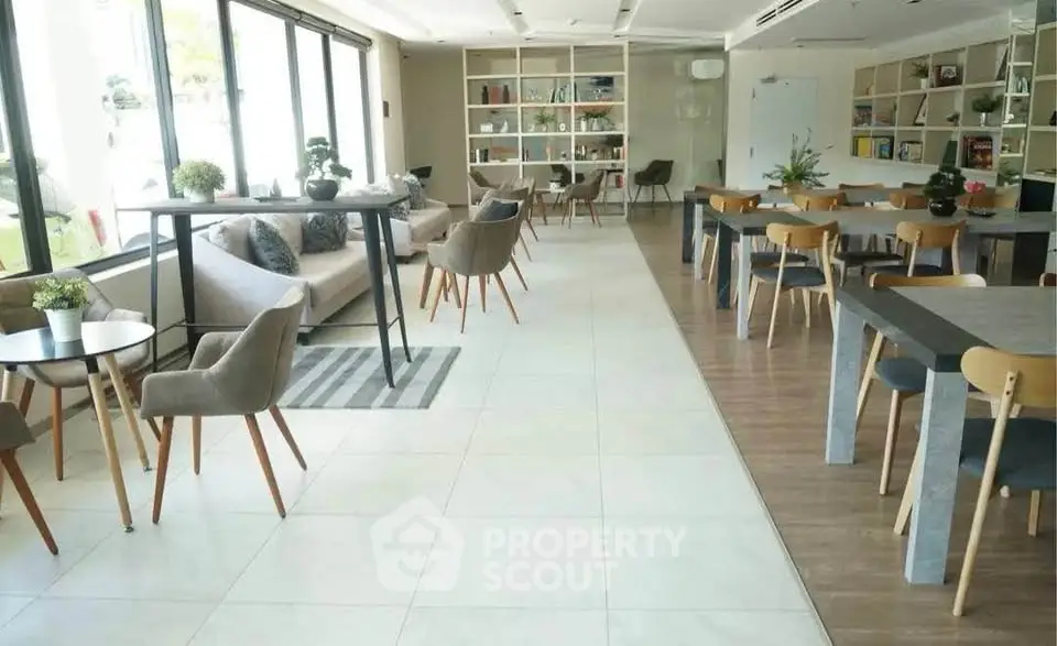 Spacious and modern co-working space with stylish furniture and ample natural light.