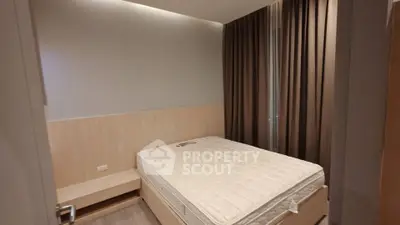 Cozy bedroom with modern design and ample natural light