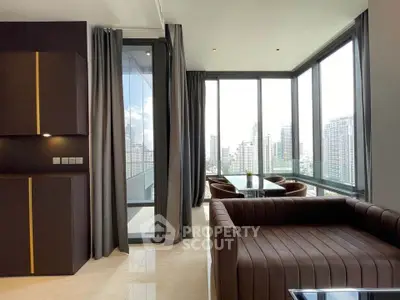 Luxurious corner unit with panoramic city views and elegant modern furnishings.