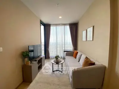 Modern living room with cozy sofa and large window offering stunning city view.
