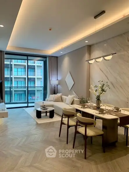 Luxurious modern living room with elegant dining area and large windows offering a stunning view.