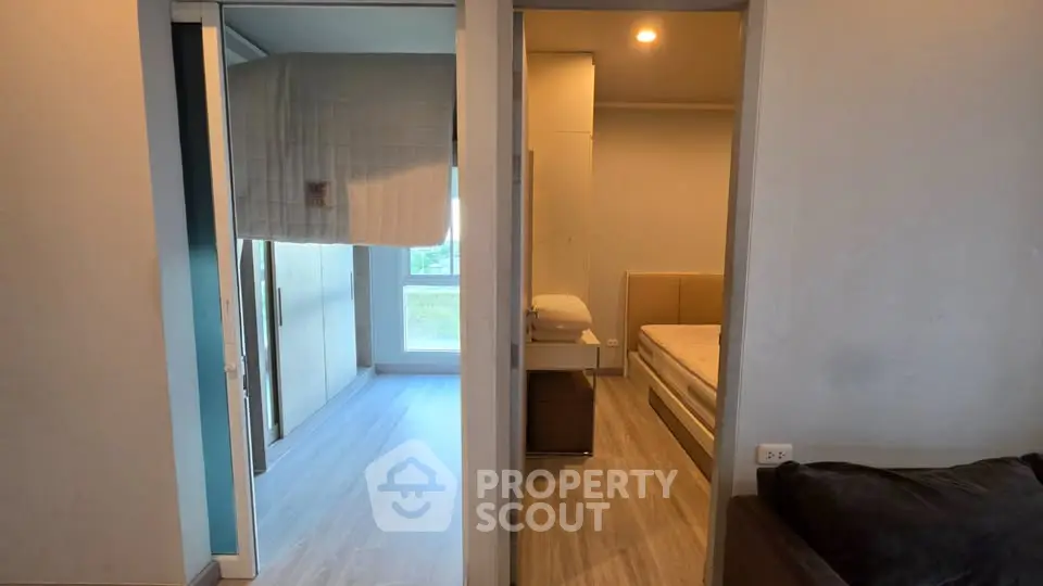 Modern apartment interior with two bedrooms featuring sleek design and natural light.