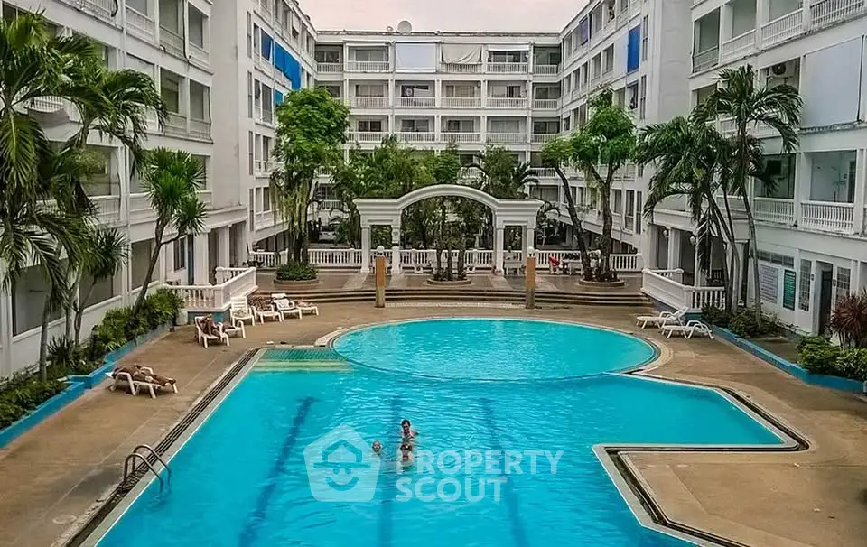 Luxurious residential complex with inviting swimming pool and lush greenery