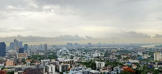 Stunning cityscape view showcasing urban skyline and lush greenery, perfect for real estate investment.