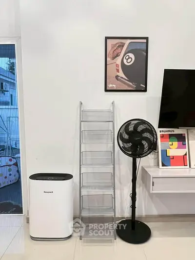 Modern interior with sleek storage, air purifier, and stylish decor in a contemporary living space.