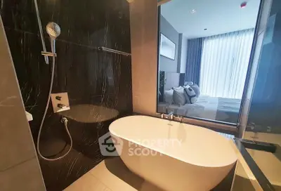 Luxurious bathroom with modern bathtub and sleek design in a high-end apartment.