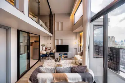 Luxurious modern living room with high ceilings and panoramic city view