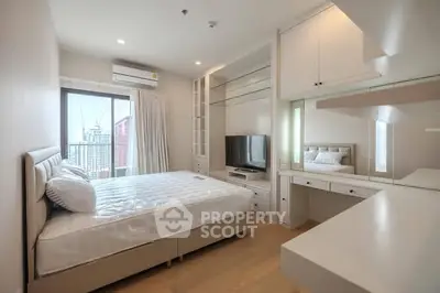 Modern bedroom with built-in storage and city view, featuring sleek design and natural light.
