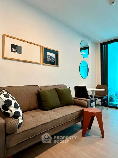 Modern living room with stylish decor and cozy seating area, perfect for relaxation and entertaining.