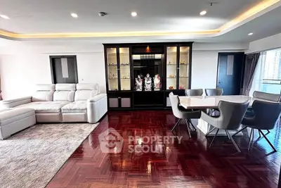 Spacious living room with elegant parquet flooring and modern furniture
