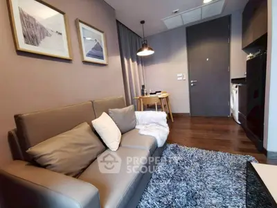 Cozy living room with modern decor and plush seating in a stylish apartment.