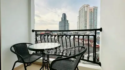 Charming balcony with city view, perfect for relaxing and enjoying the skyline.