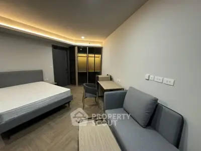 Modern bedroom with stylish furniture and ambient lighting