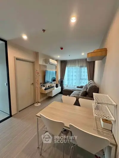 Modern living room with cozy sofa and dining area in a stylish apartment