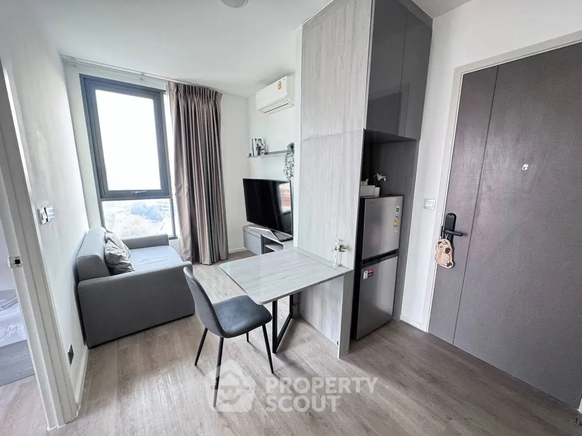 Modern compact living room with stylish decor and natural light